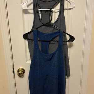 2 EUC swiftly Lululemon tanks. Size 12